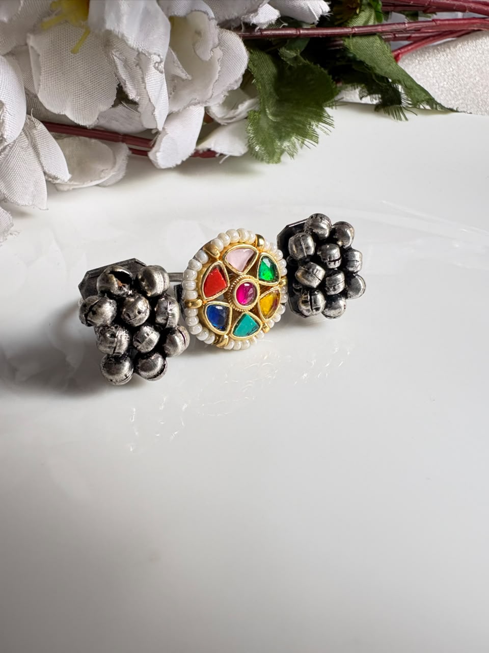 Navrang SLA Fusion Ghungroo Statement Ring

Handcrafted Adjustable Antique Silver Ring | Navratna-Inspired Kundan Cocktail Ring | Designer Ethnic Jewellery
