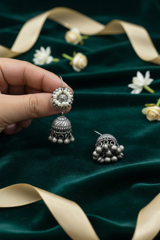Aarini German Silver Jhumka Earrings Online | Oxidised Ghungroo Pearl Jhumkas for Women