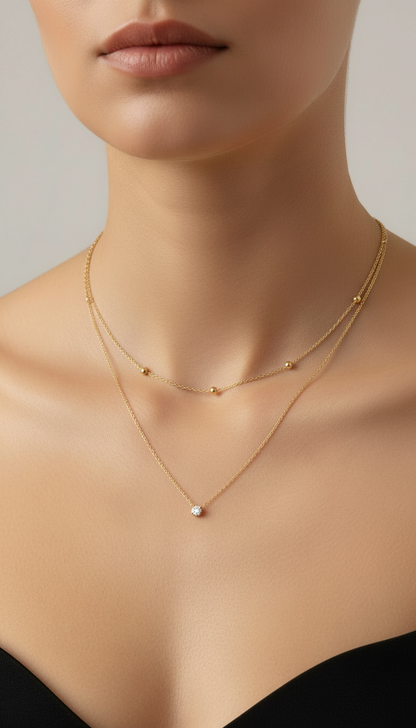 Double-layered gold necklace on a mannequin bust with price label '260'.